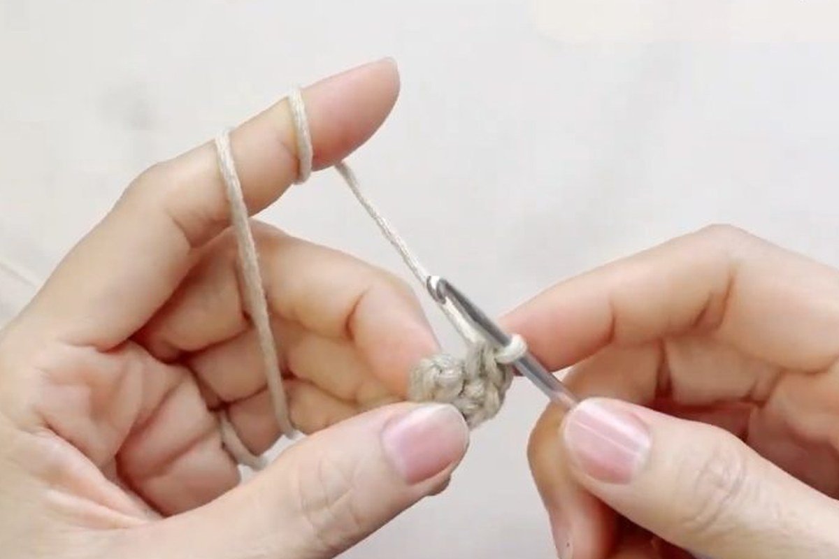magic ring with 6 single crochet, round 1 of a free crochet pinecone pattern