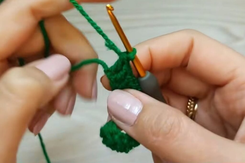 Three double crochet in the last chain to turn around the end of the oval base