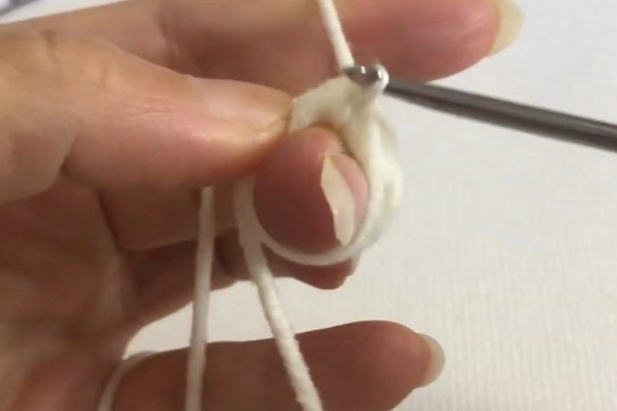 one chain stitch locks the first loop of a puff stitch crochet snowflake