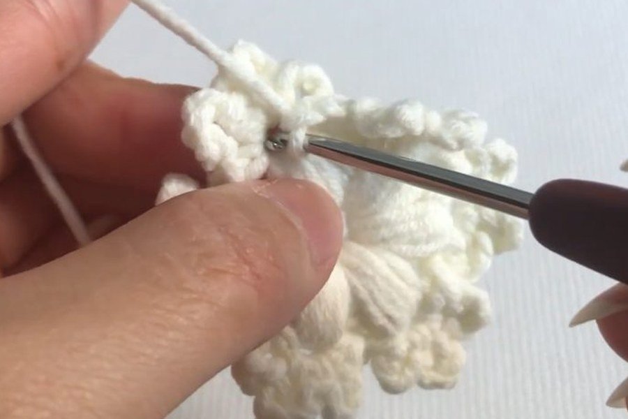 chain two and hook into the first puff chain to close a puff stitch crochet snowflake