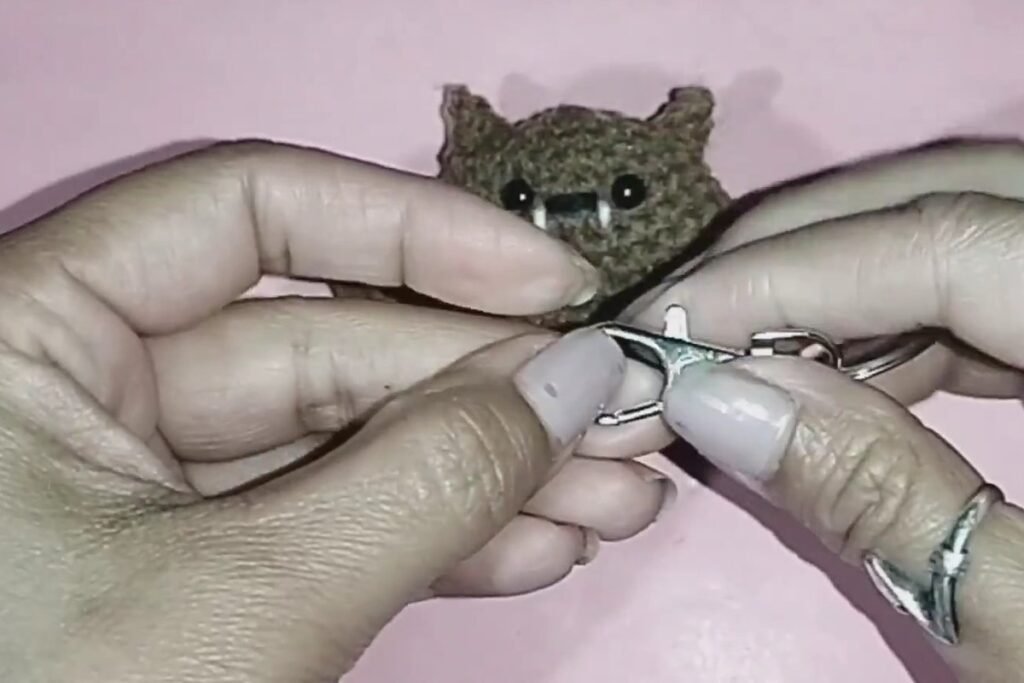 attaching a keyring clasp to the crochet bat keychain
