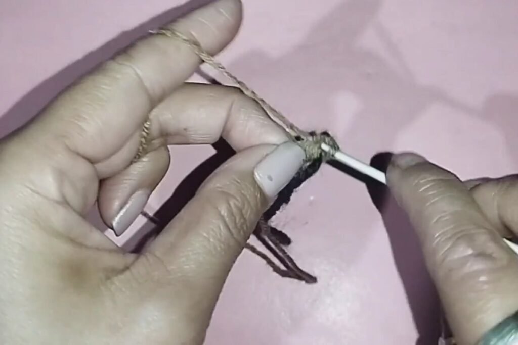 round 2 of a crochet bat keychain with 12 stitches