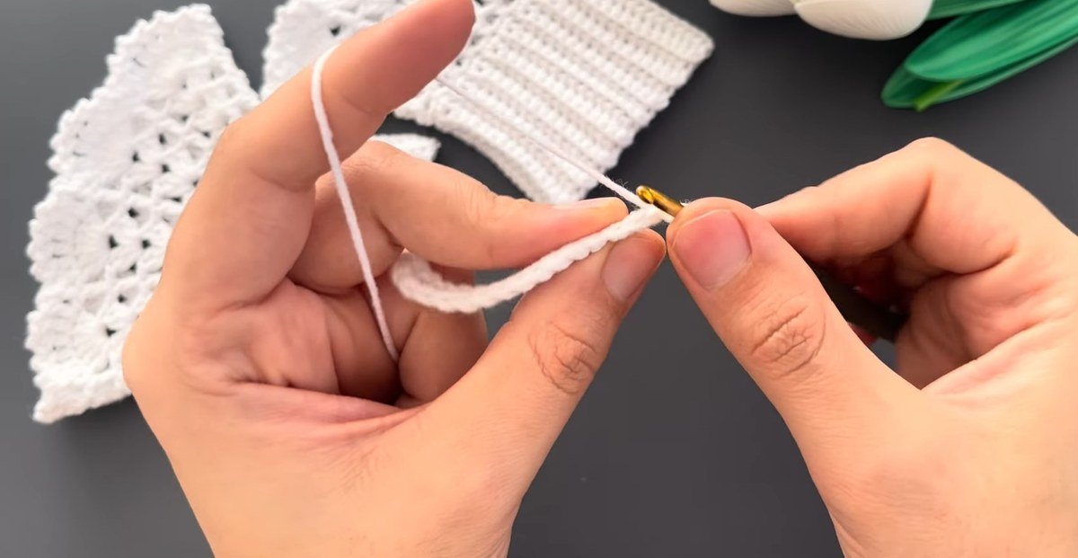 first row of single crochet on the ribbed band of crochet lace wrist cuffs
