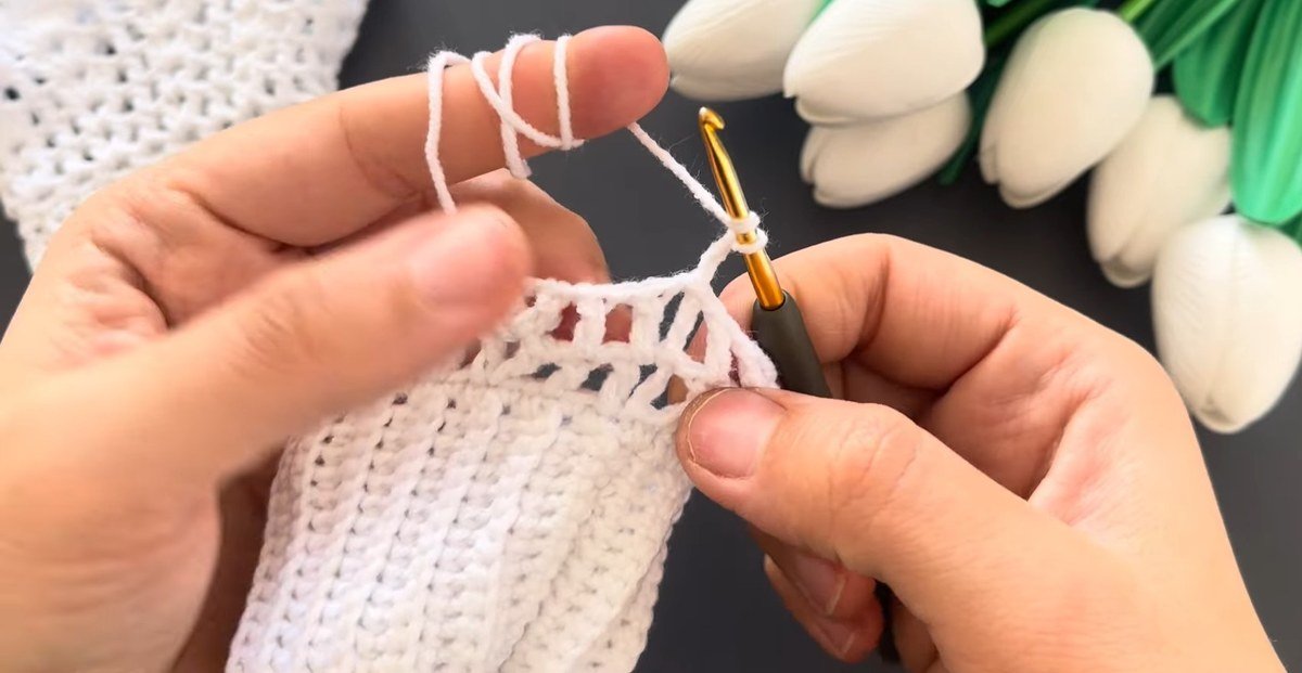 working the 2 double crochet 2 chain 2 double crochet group on crochet lace wrist cuffs