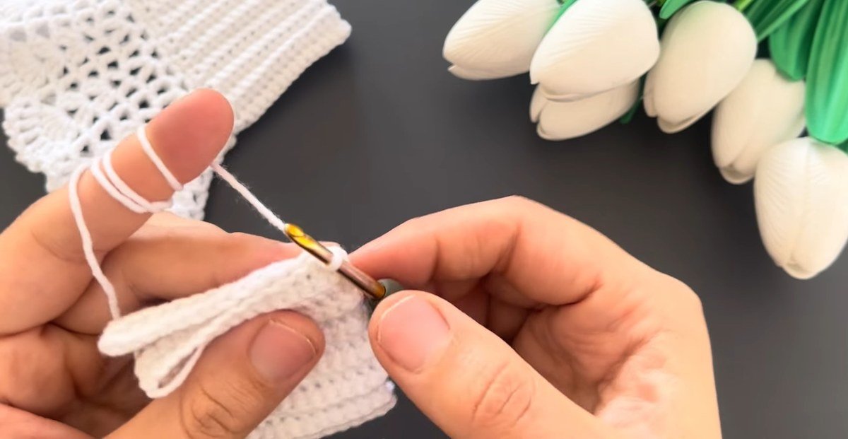 slip stitch seam joining the ribbed band of crochet lace wrist cuffs