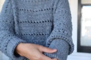 crochet pullover sweater pattern: finished bead stitch sweater worn, close view of the sleeve and body