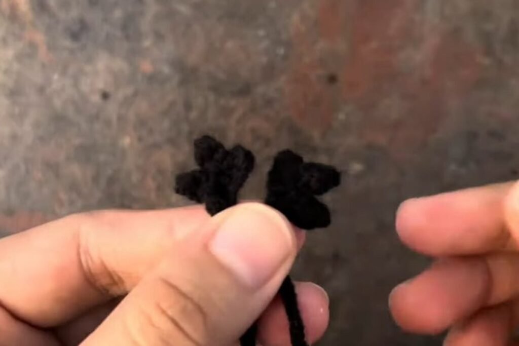 two small black crochet claw feet for the owl amigurumi