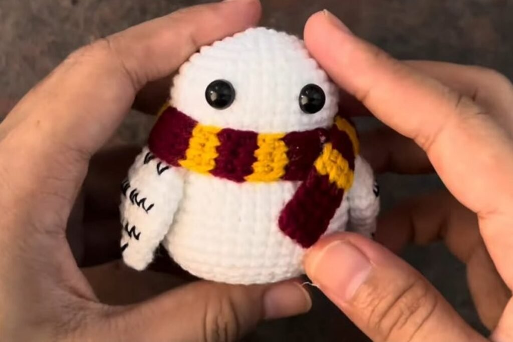 crochet snowy owl pattern assembly with eyes, wings and scarf attached
