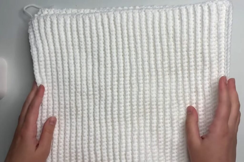 Finished easy crochet scarf pattern laid flat with straight edges and even ribs