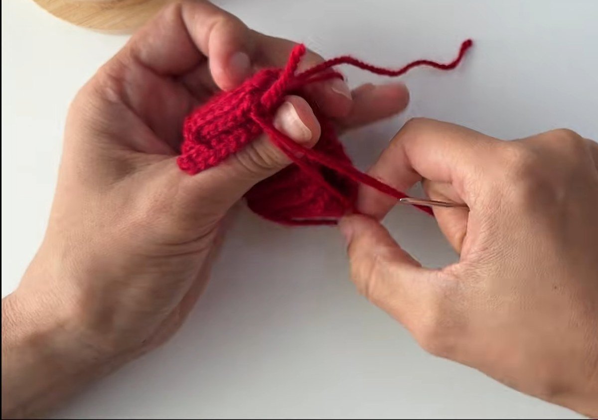 mattress stitch seam closing the cuff of a free crochet fingerless gloves pattern