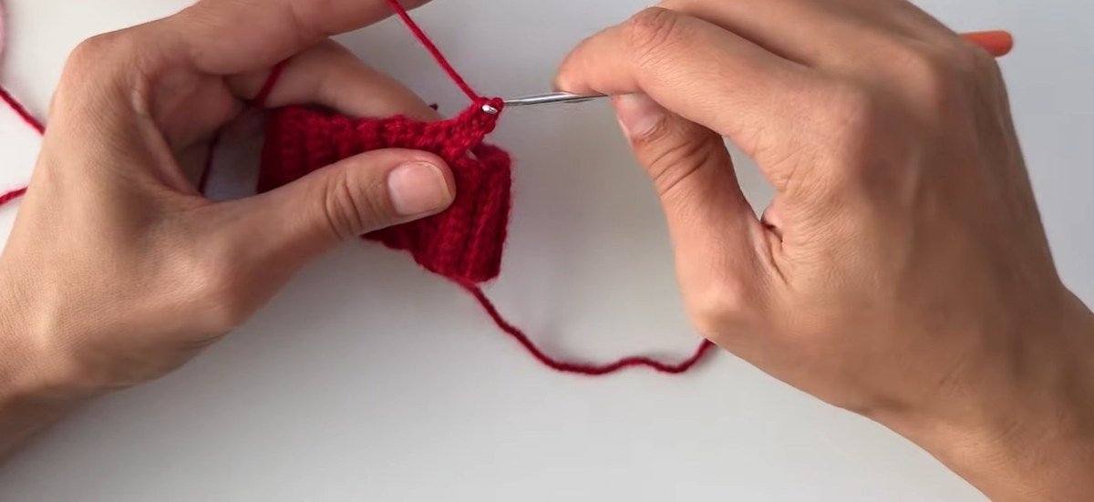 first round of double crochet along the cuff of a free crochet fingerless gloves pattern