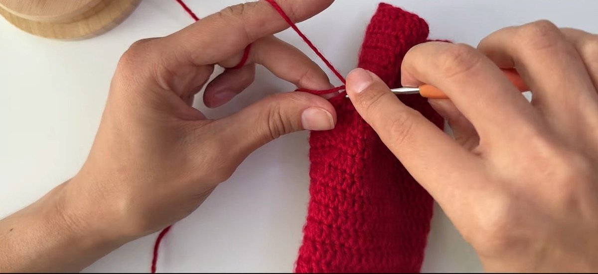 second decrease in the first thumb round of a free crochet fingerless gloves pattern