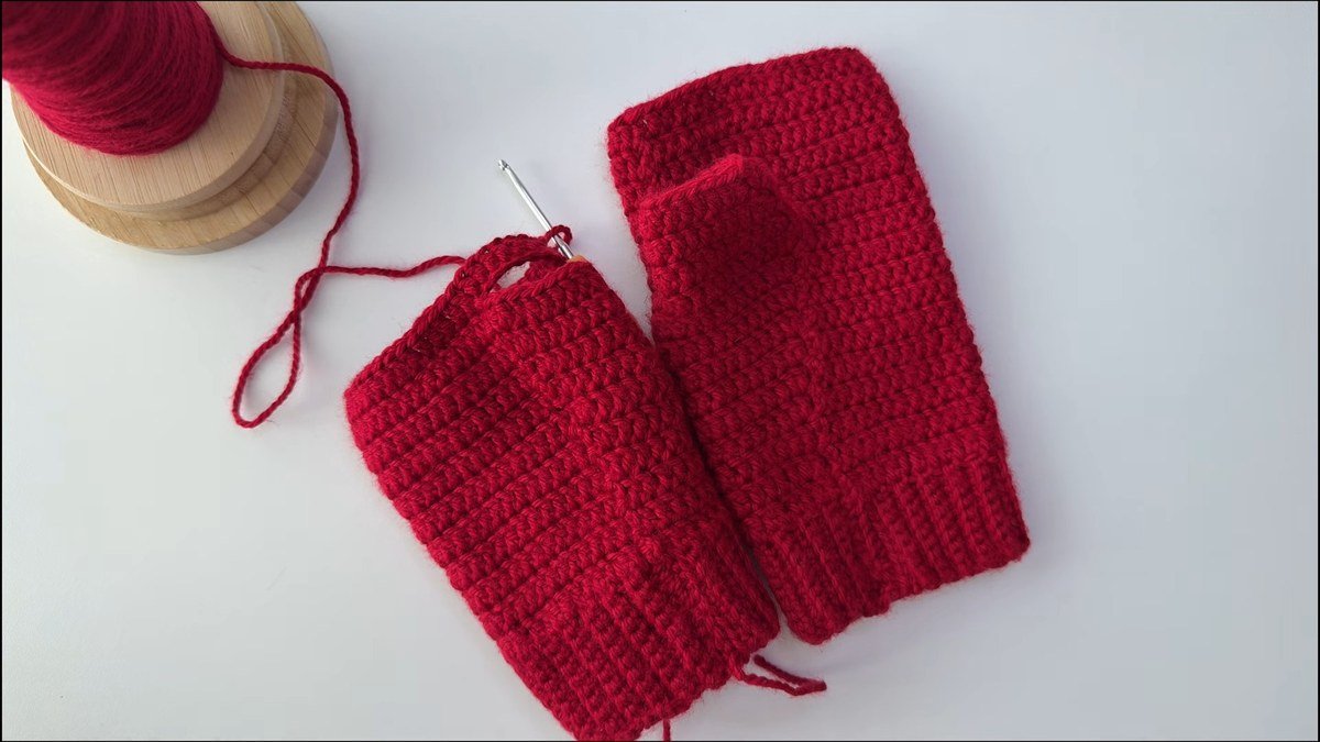 finished pair of red crochet fingerless gloves made from a free crochet fingerless gloves pattern