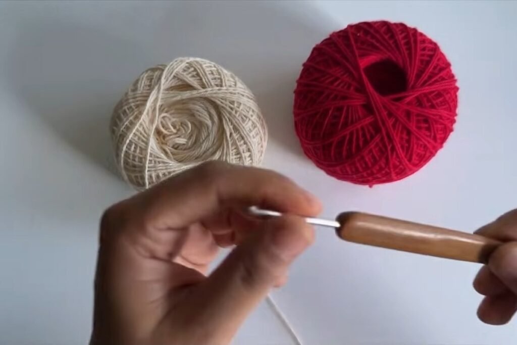 Cream and red 4-ply cotton with a 2.75 mm hook for the free crochet head scarf pattern