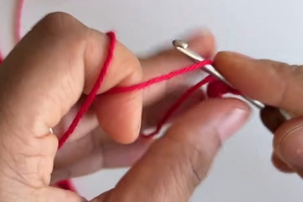 Crocheting five petals in a magic ring for the head scarf tie