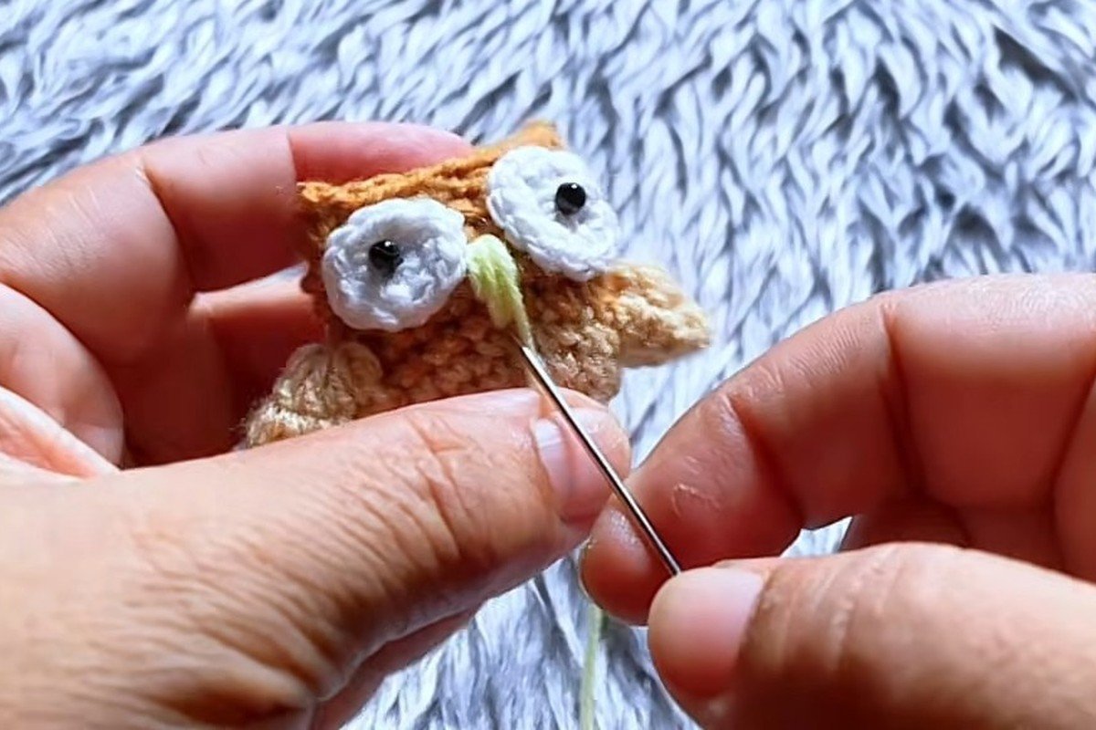 free crochet owl pattern step 18: embroider the beak