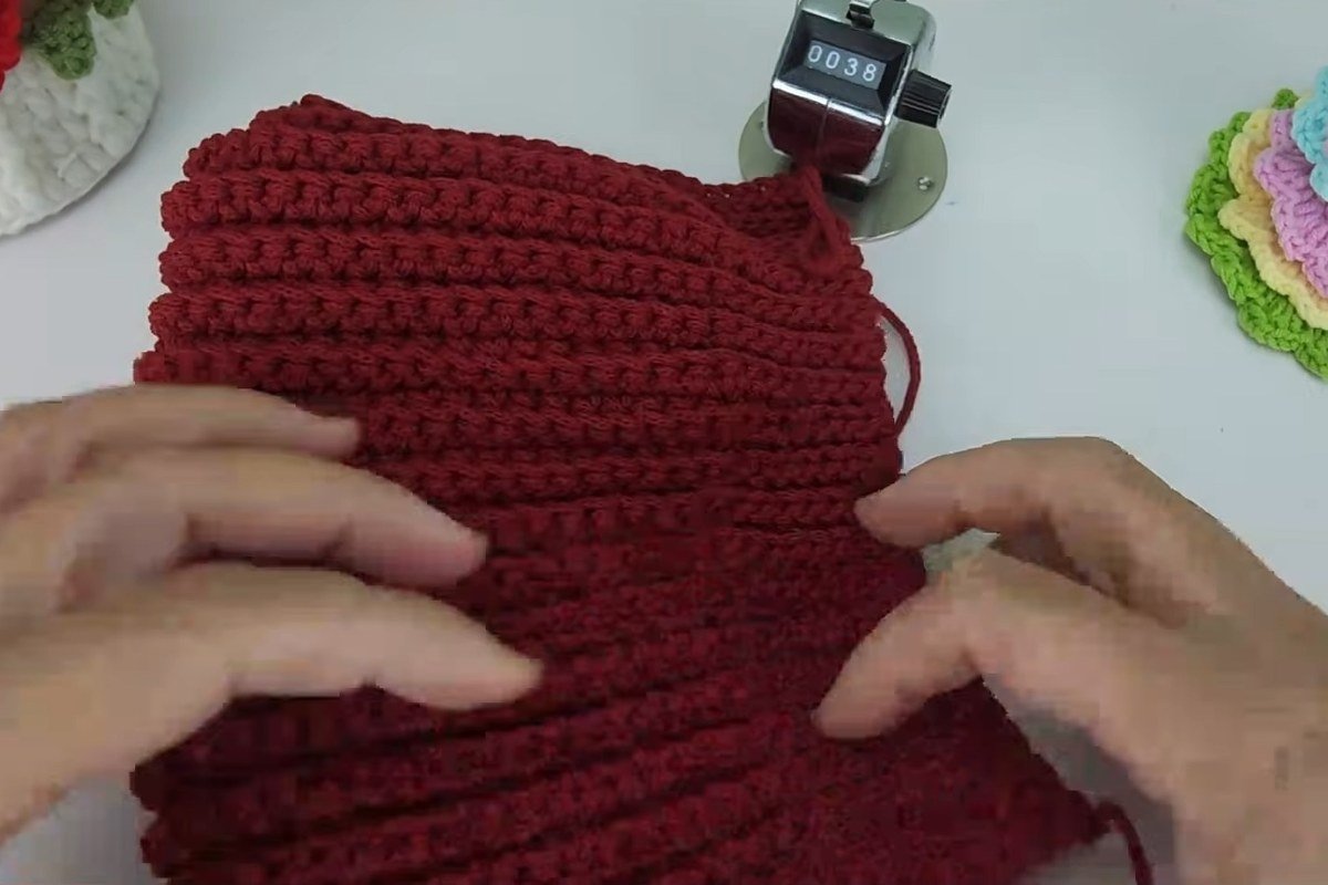 Folding the ribbed panel in half so the side edges line up