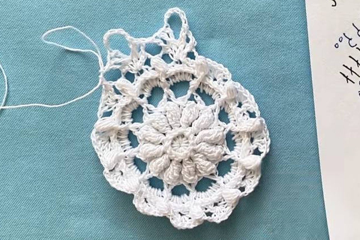free crochet snowflake pattern after round 8 with large open loops