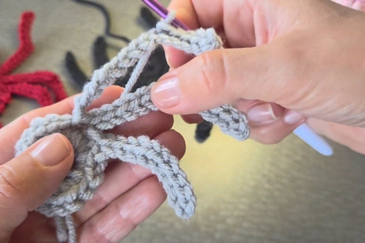 third leg curling up in a crochet spider pattern