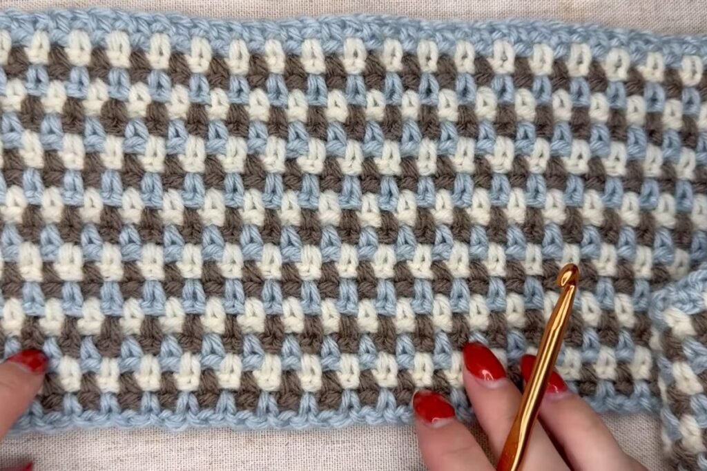 close-up of moss stitch crochet scarf texture after many rows