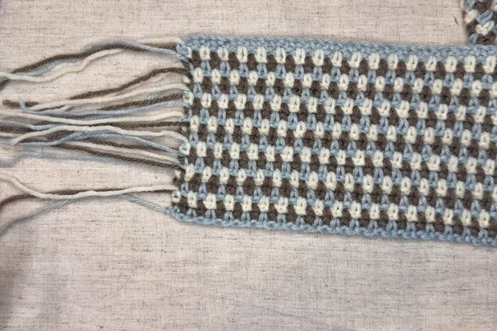 moss stitch crochet scarf end with long yarn tails after the last row