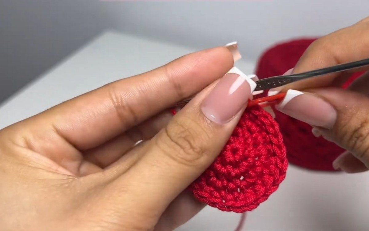 plain single crochet rounds shaping the bowl of a crochet cherry keychain