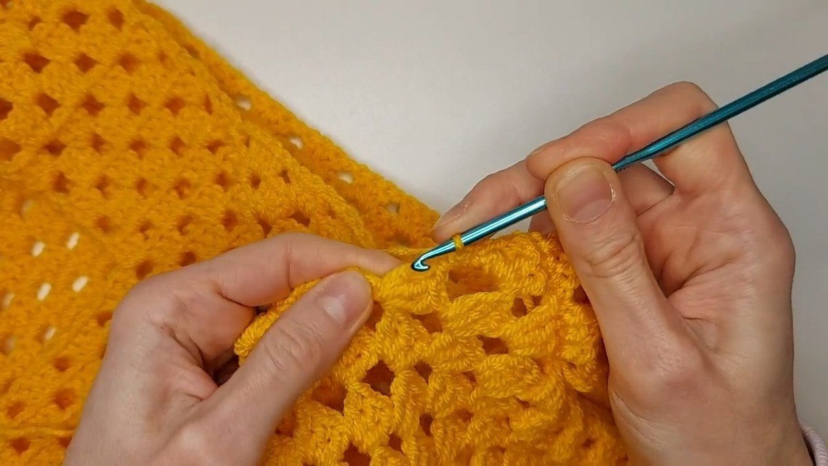 row of single crochet foundation around the armhole of a crochet vest pattern