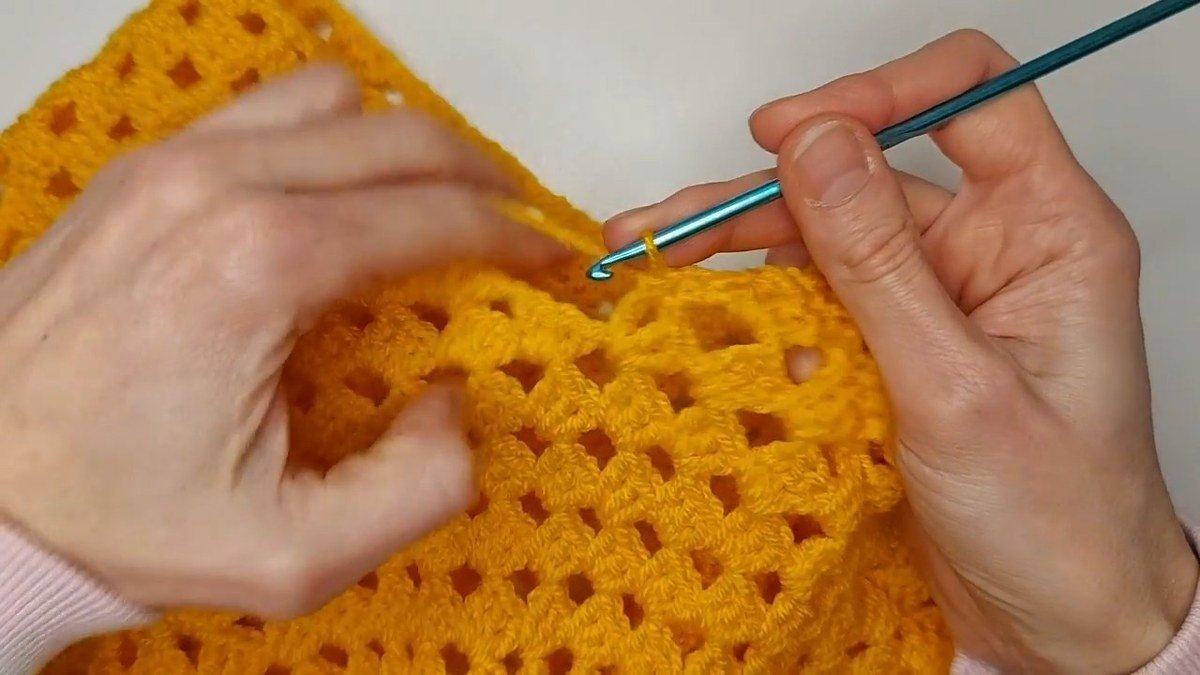 decrease at the corner of the armhole edge of a crochet vest pattern