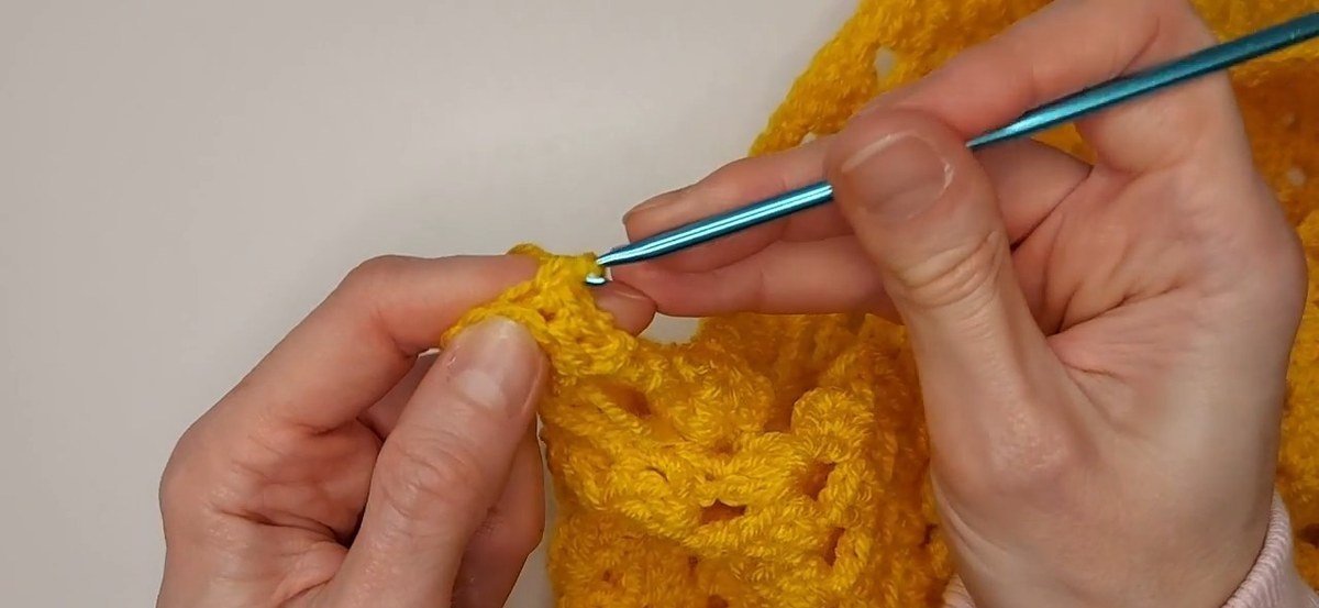 five single crochet in the back loop only forming the ribbing of a crochet vest pattern